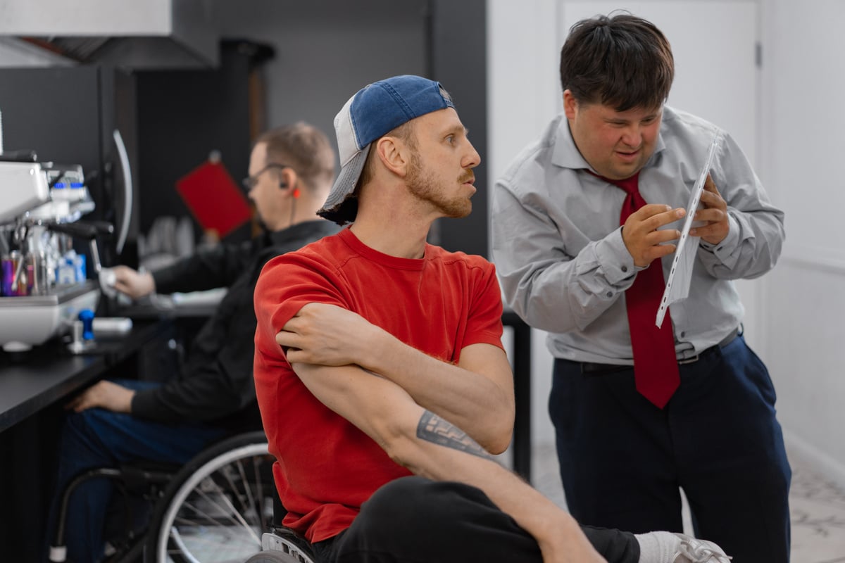 Man in Red Crew Neck T-shirt Sitting on Wheelchair